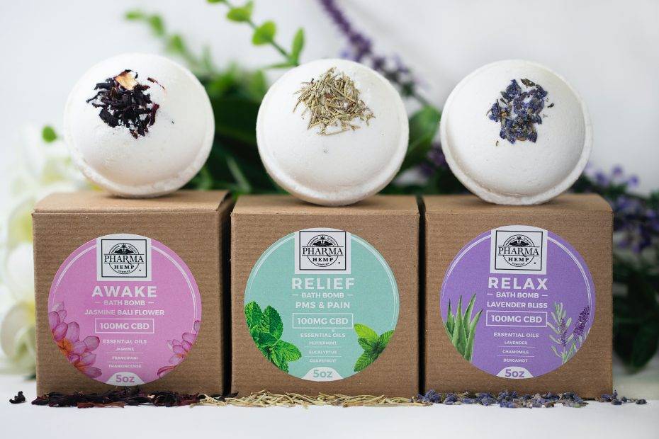 three assorted-label bath bombs with boxes